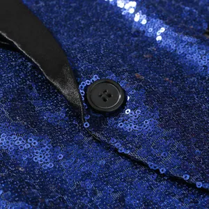 Close-up of blue sequin blazer with black satin lapel and button detail