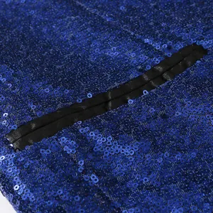 Macro close-up detail of brilliant royal blue sequined fabric for stage performance blazer