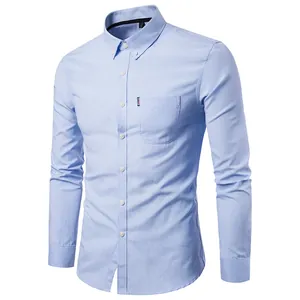 Detail view of a men's light blue long-sleeve Oxford shirt with button-down collar.