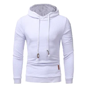 Close-up detail of white men's pullover hoodie featuring a unique quilted grid design