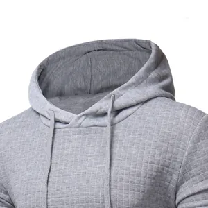 Close-up detail of the gray quilted texture on a men's casual pullover drawstring hoodie