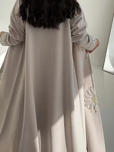 Detailed view of sunflower embroidery on elegant long grey cardigan robe for women