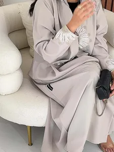 Detailed view of the sunflower embroidery on this elegant grey plus size cardigan robe for women