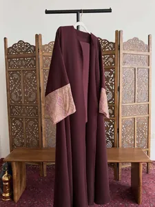 Elegant burgundy Abaya featuring vintage printed batwing sleeves, long cardigan style.
