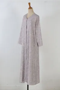 Elegant lavender floral print long-sleeved maxi dress displayed on a mannequin