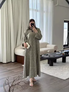 Elegant olive green long-sleeved abaya maxi dress with subtle floral pattern details