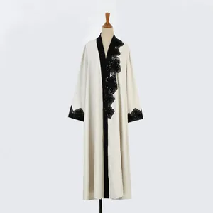 Elegant off-white long open cardigan featuring intricate black floral lace embroidery details.
