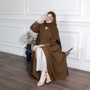 Elegant brown long robe featuring gold embroidered sleeves and a matching hijab set