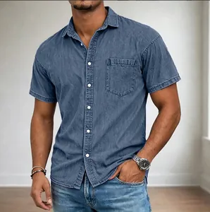 Close-up detail of a men's blue denim short-sleeve button-down shirt with chest pocket