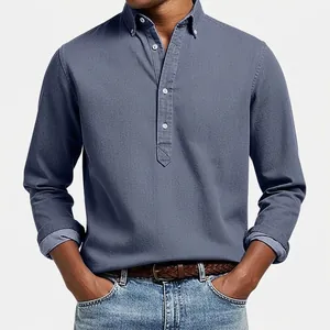 Close-up of men's dusty blue textured long sleeve polo shirt with button-down collar