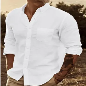 Detailed view of men's classic white long-sleeved button-down shirt worn by model