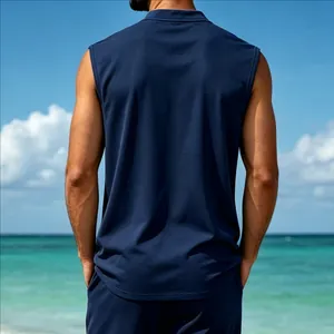 Back view of a men's navy blue quick-dry tank top in a tropical beach setting