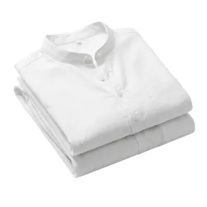 Close-up detail of folded white linen Henley collar shirts featuring a neat chest pocket