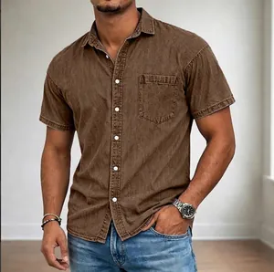 Detailed view of a brown men's short-sleeved denim shirt with front pocket and buttons