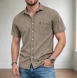 Detailed view of a men's vintage washed brown denim shirt with a chest pocket and lapel collar.