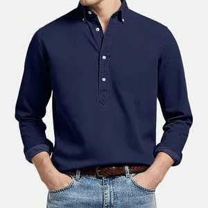 Detail view of men's navy blue long sleeve polo shirt with textured jacquard fabric