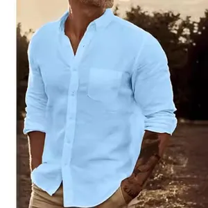 Men's casual light blue long sleeve button-down shirt with pocket in outdoor setting