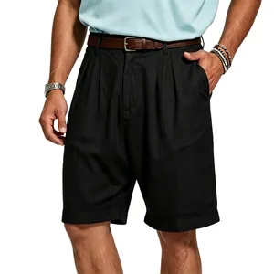 Detail shot of men's black pleated linen shorts showing breathable fabric texture