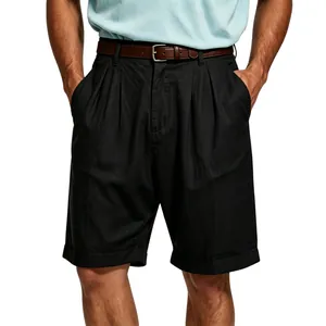 Detailed macro view of black pleated linen shorts for men with breathable fabric texture