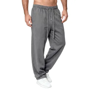 Detailed view of men's gray waffle knit casual pants with elastic drawstring waist