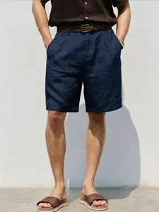 Detailed view of men's navy blue breathable linen shorts with a relaxed straight fit