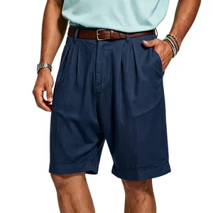 Detail view of men's navy blue pleated linen shorts with a leather belt