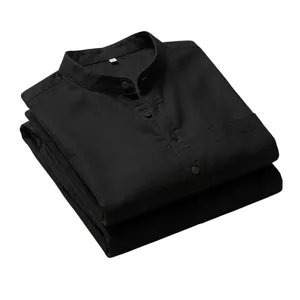 Black linen Henley shirt folded on white background with button and pocket detail
