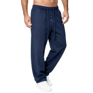 Detailed view of men's navy blue waffle knit lounge pants featuring a functional drawstring waist