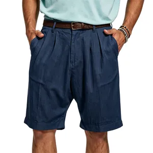 Detailed view of navy blue pleated linen shorts featuring breathable summer fabric texture