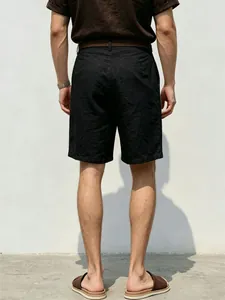 Rear view of men's black linen casual shorts with a loose straight fit