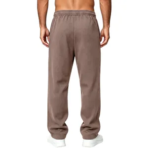 Detailed back view of men's brown waffle knit loose casual pants with elastic waist