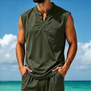 Close-up detail of men's olive green quick-dry sleeveless V-neck vest in beach setting