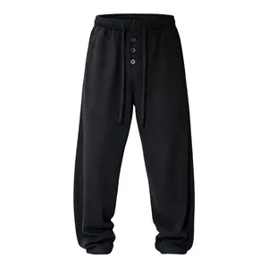 Men's waffle knit loose casual pants with adjustable drawstring waist in solid black