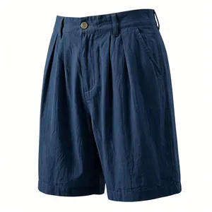 Close-up detail of navy blue linen pleated shorts for men with secure button closure