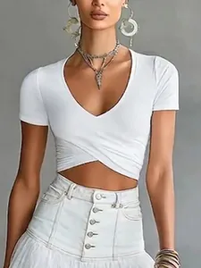 Close-up of white V-neck wrap crop top with slim fit and cross hem design