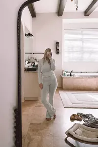 Grey long-sleeve top and flared pants two-piece loungewear set shown in a mirror selfie.
