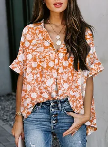 Detailed view of a stylish women's orange floral V-neck Polo shirt with elegant half sleeves