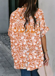 Back view of women's orange floral print shirt with button details and short sleeves
