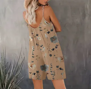 Back view of floral print sleeveless jumpsuit with low back and spaghetti straps.