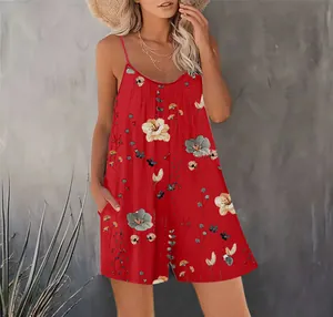 Chic red floral sleeveless romper with spaghetti straps and handy side pockets on model
