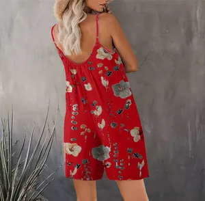 Back view of a red floral sleeveless jumpsuit with adjustable spaghetti straps