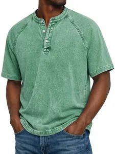 Detail of men's retro distressed green cotton Henley shirt with button neckline.