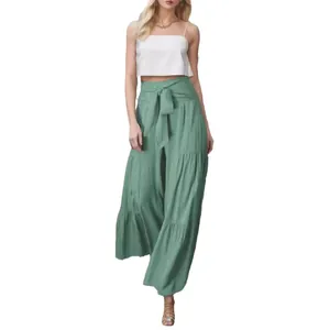 Pantaloni a gamba larga verdi a balze da donna con elegante fiocco in vita e pieghe