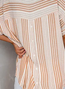 Close-up detail of women's striped V-neck polo shirt with functional buttons and lightweight fabric