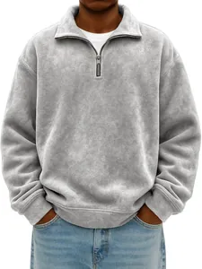 Close-up detail of men's grey half-zip sweatshirt with distressed texture and collar