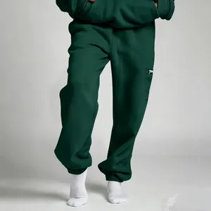Σκούρο πράσινο oversized unisex παντελόνι φόρμας με τσέπη με φερμουάρ για το χειμώνα.