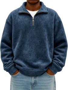 Detail of navy blue half-zip sweatshirt with vintage washed texture and metal zipper