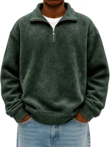 Macro view of men's dark green half-zip sweatshirt showing vintage washed fabric texture