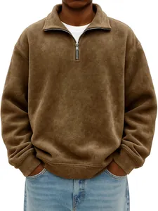 Close-up of men's brown half-zip vintage wash sweatshirt in a relaxed loose fit design