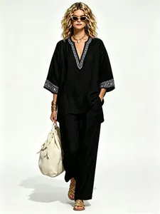 Full view of a stylish black bohemian linen two-piece set with V-neck embroidery